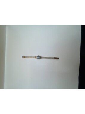 Bulova Women's Vintage Quartz Dress Watch with Blue Dial and Gold-Tone Bracelet